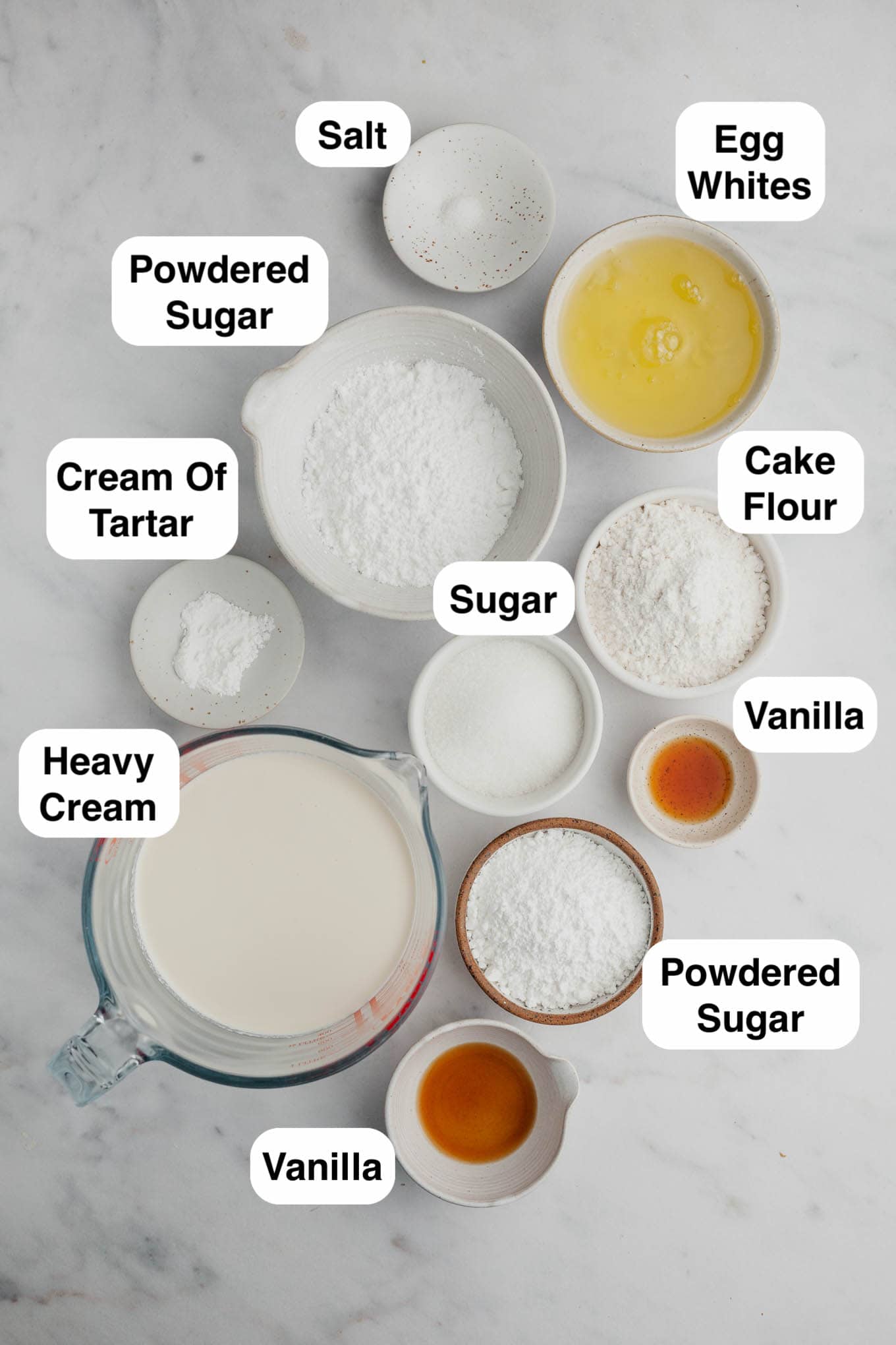 An overhead view of the ingredients needed to make angel food cake cupcakes. 