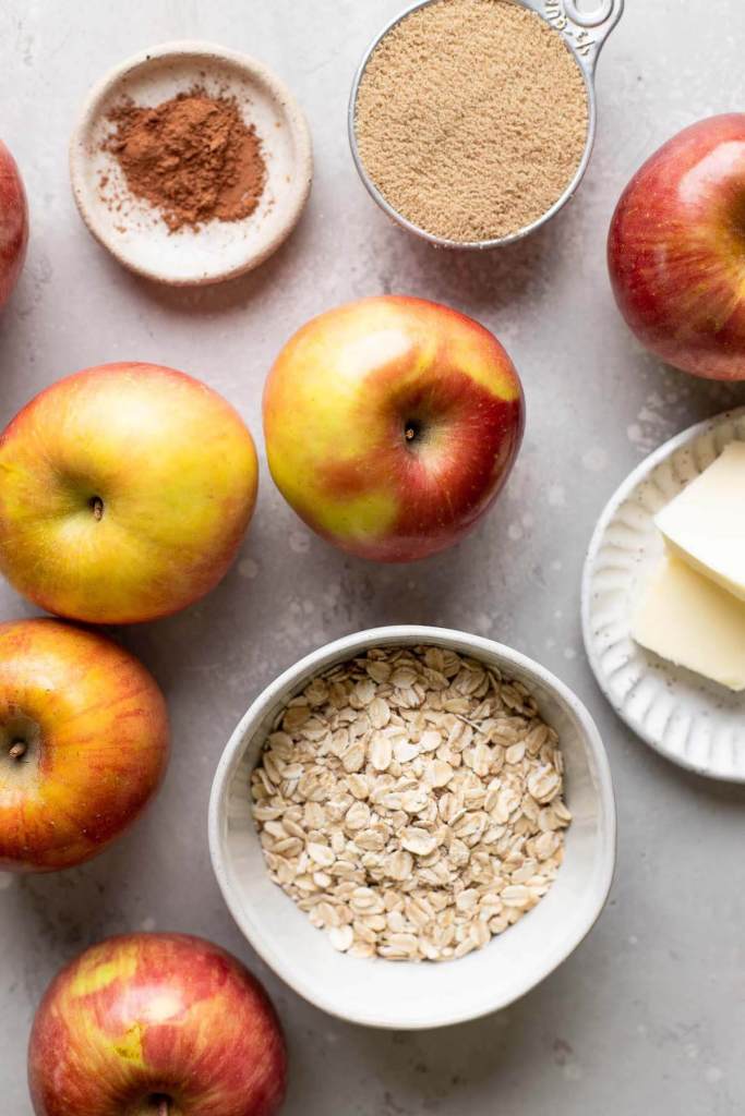 An overhead view of the ingredients needed to make baked apples in the oven.