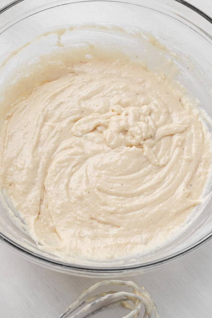 Donut batter in a glass mixing bowl.