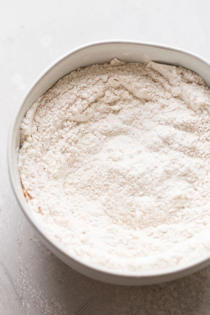 Dry pancake ingredients in a white mixing bowl.