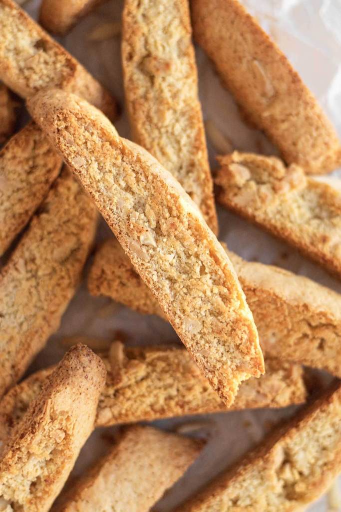 An overhead view of a pile of almond biscotti cookies. 