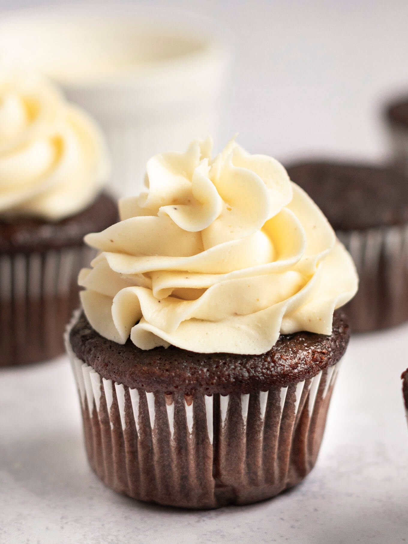 A chocolate cupcake topped with brown butter frosting.