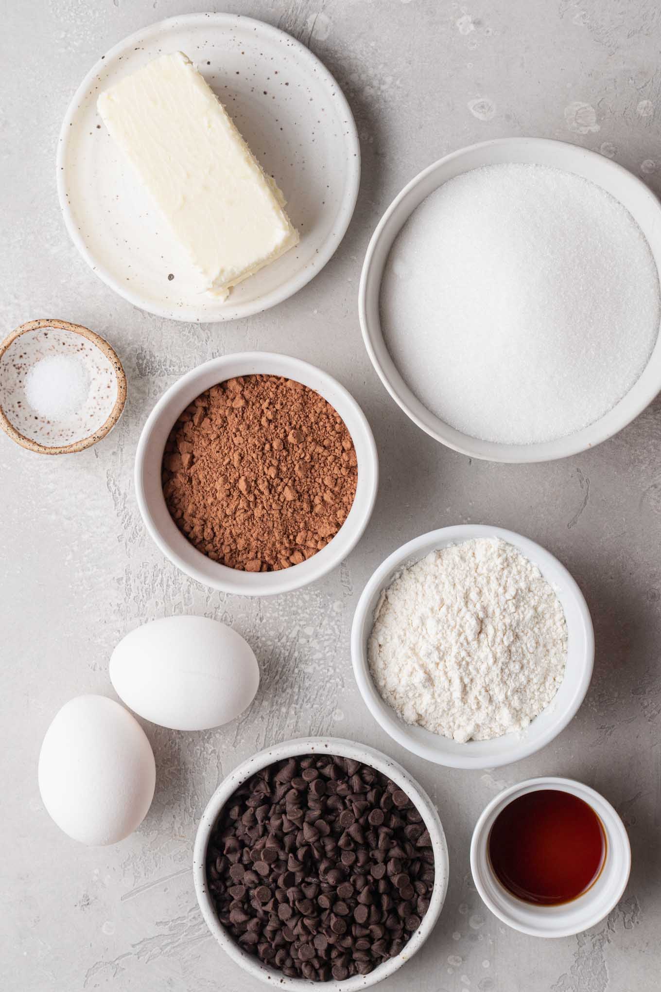 An overhead view of the ingredients needed to make mini brownie bites. 