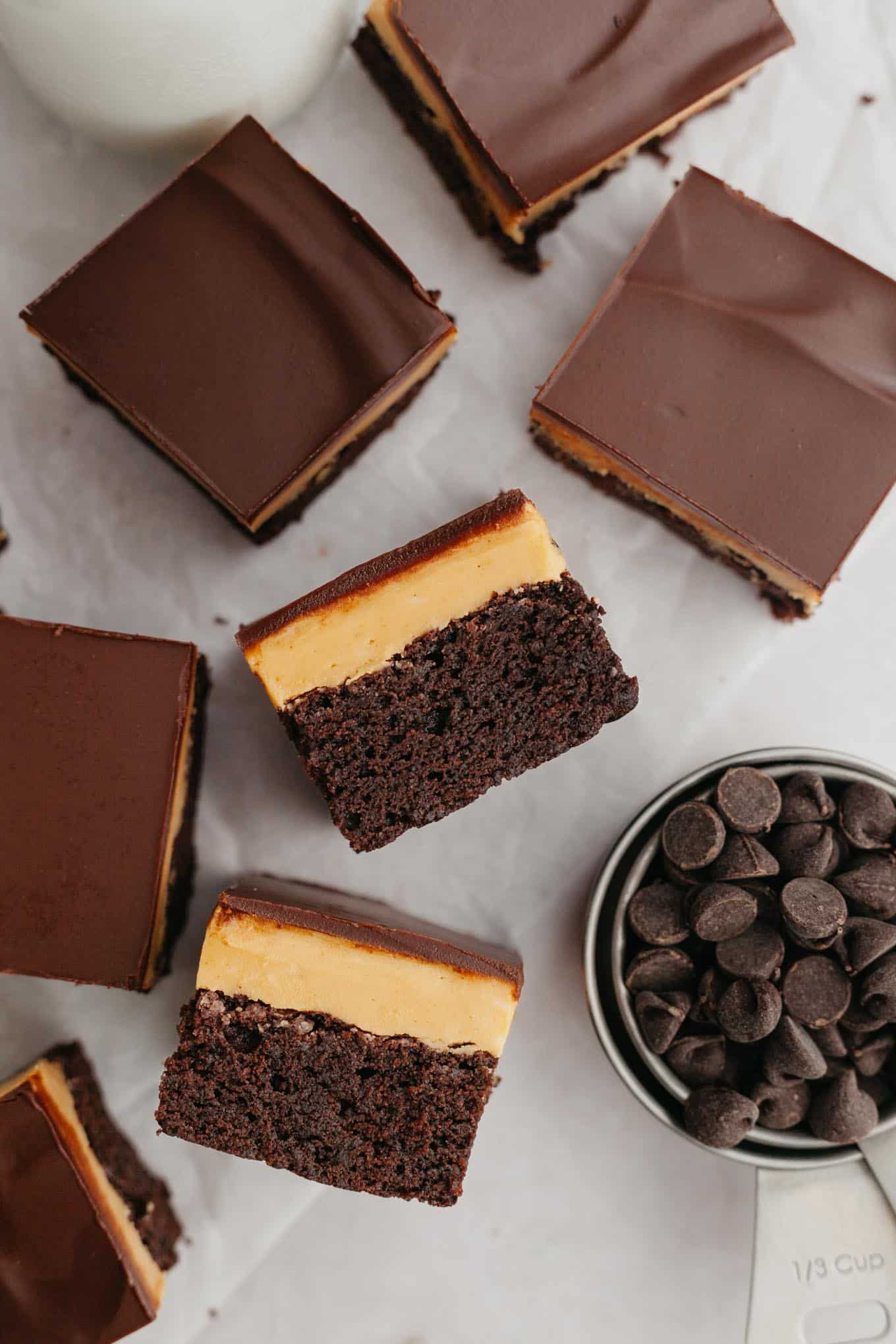 An overhead view of two Buckeye brownies turned on their sides to show their layers. 