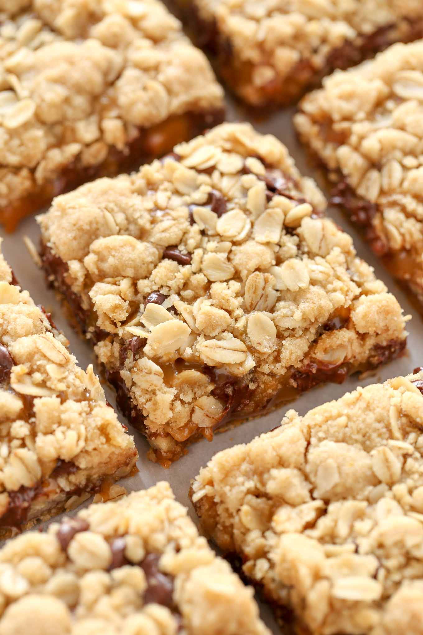 A close up shot of sliced oatmeal caramel bars. 