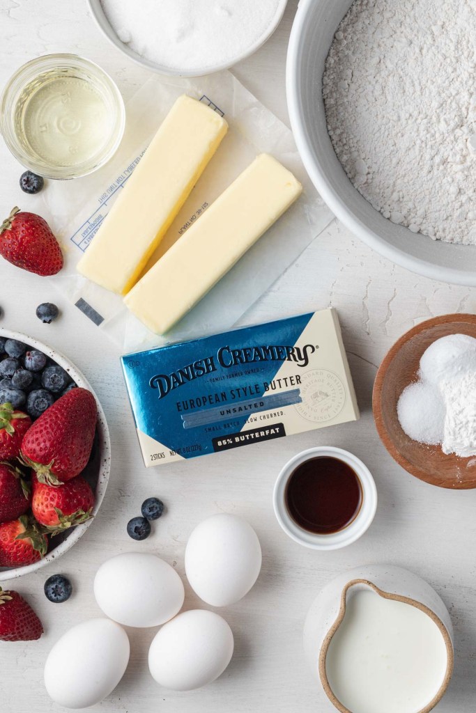 An overhead view of the ingredients needed to make a Chantilly cream cake.