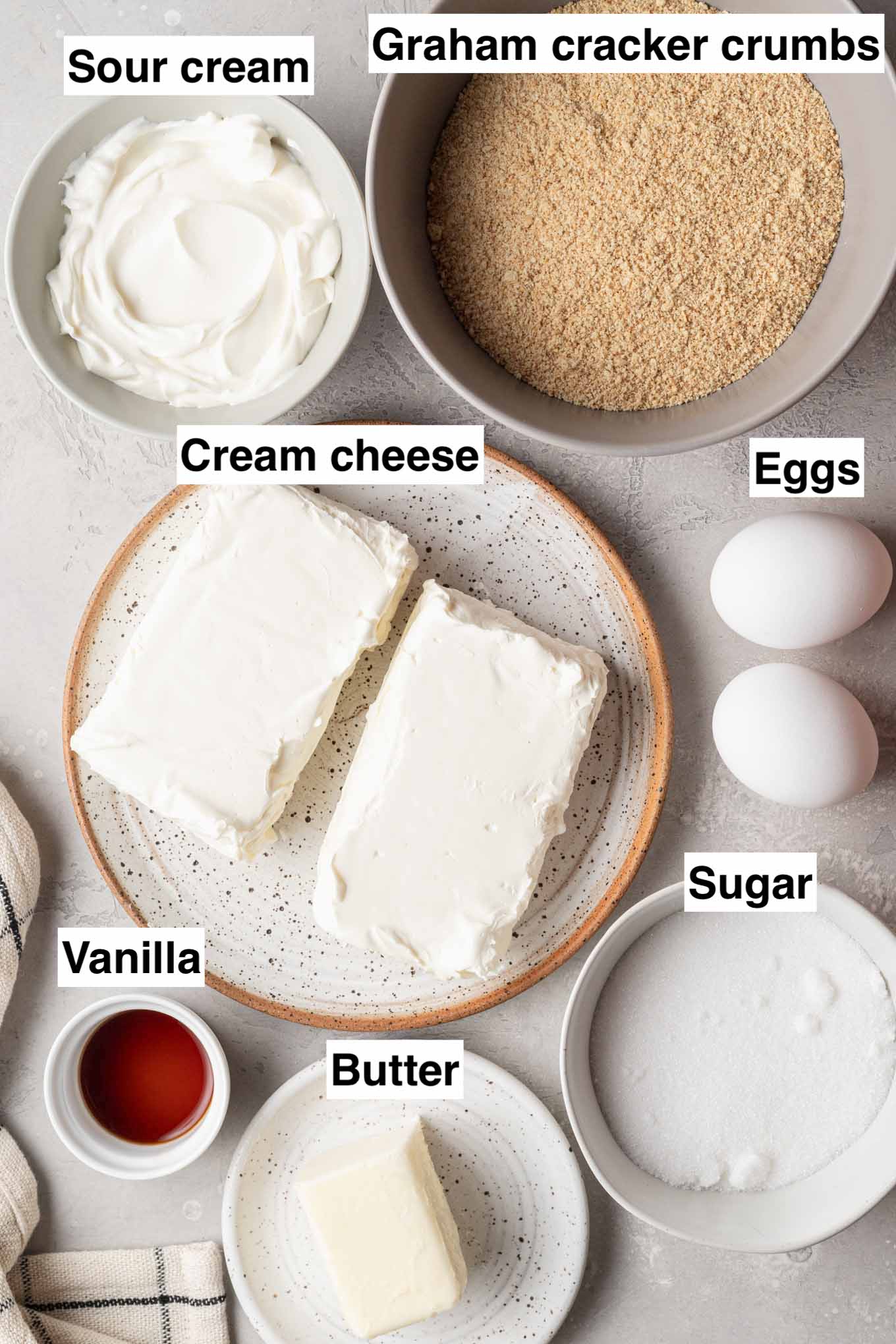 An overhead view of the ingredients needed to make creamy homemade cheesecake bars.