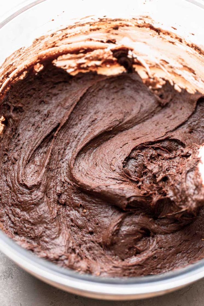 A glass mixing bowl holding the finished batter ready to be scooped out.