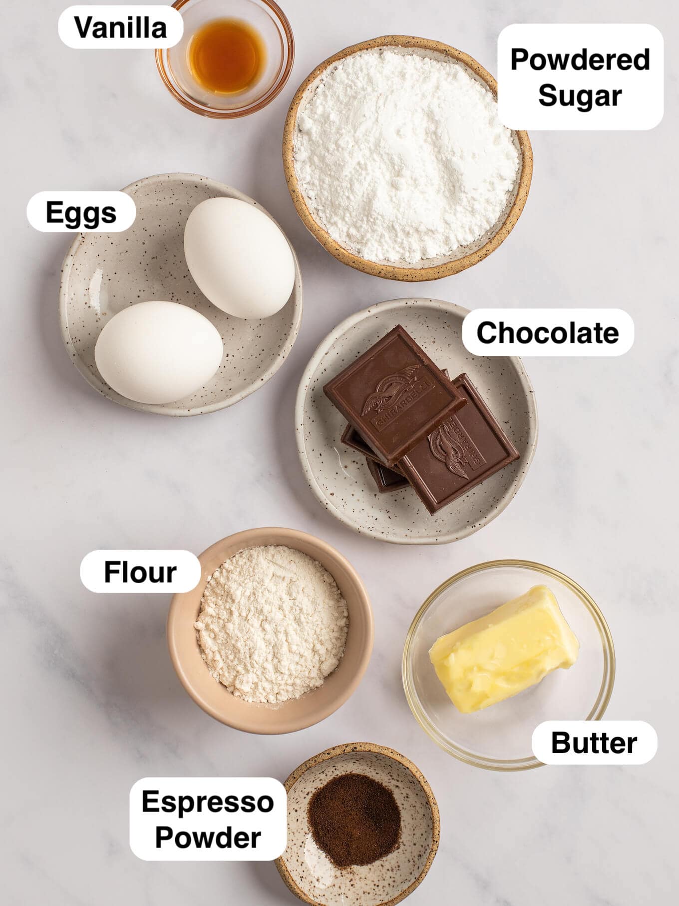 An overhead view of the various ingredients for chocolate lava cakes.