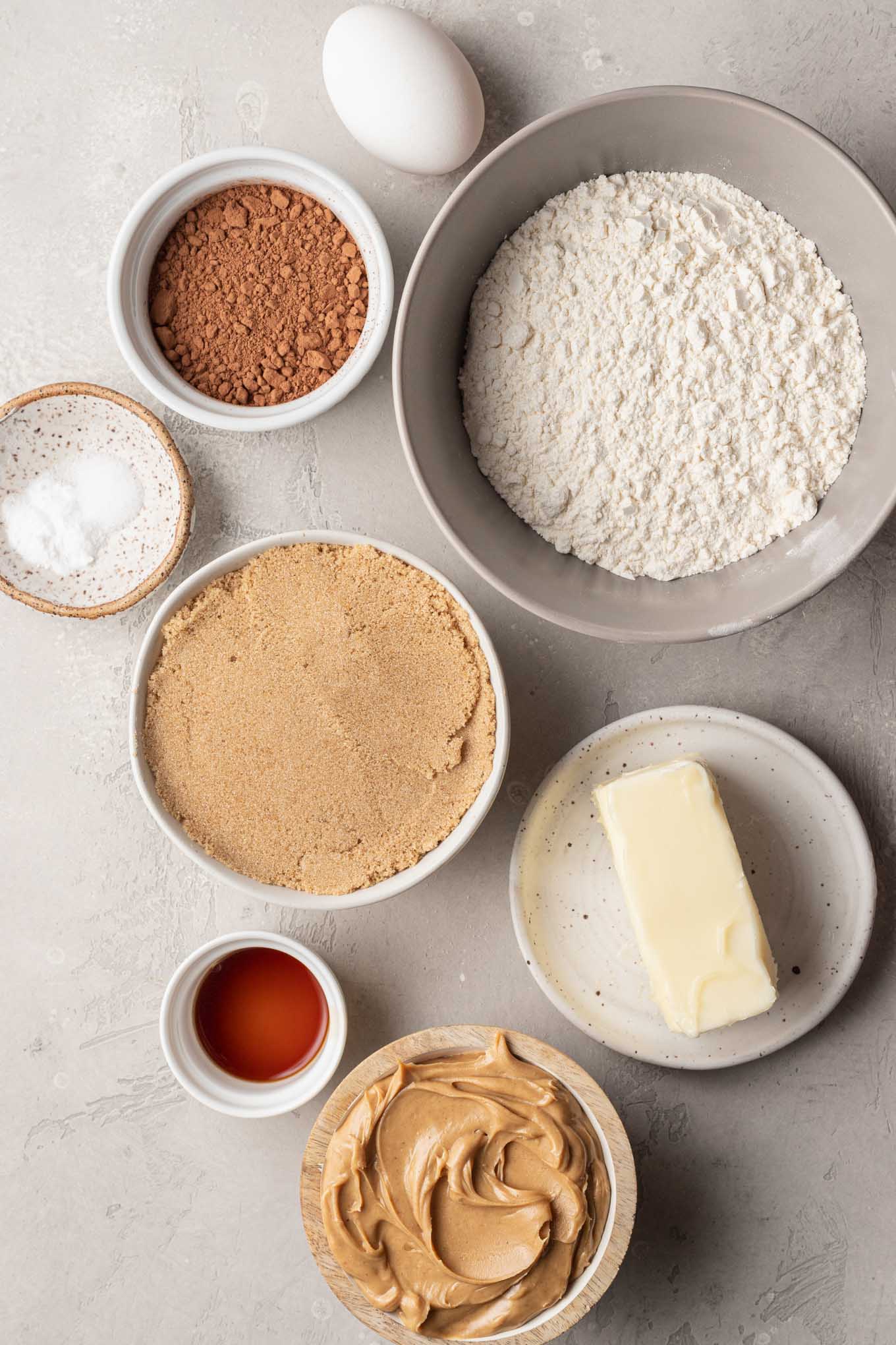 An overhead view of the ingredients needed for chocolate peanut butter cookies. 