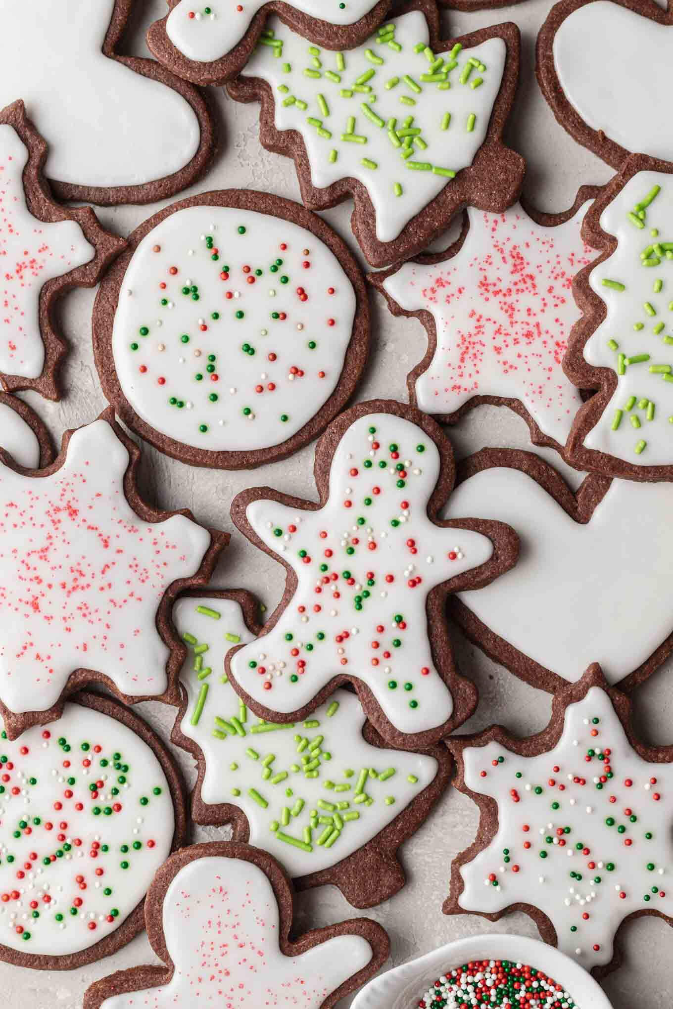 An overhead view of iced chocolate sugar cookies. 