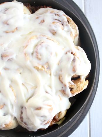 Overhead view of frosted homemade cinnamon rolls without yeast.