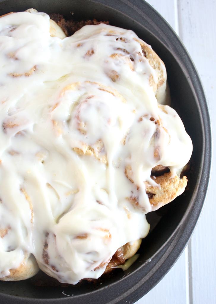 Overhead view of frosted homemade cinnamon rolls without yeast. 