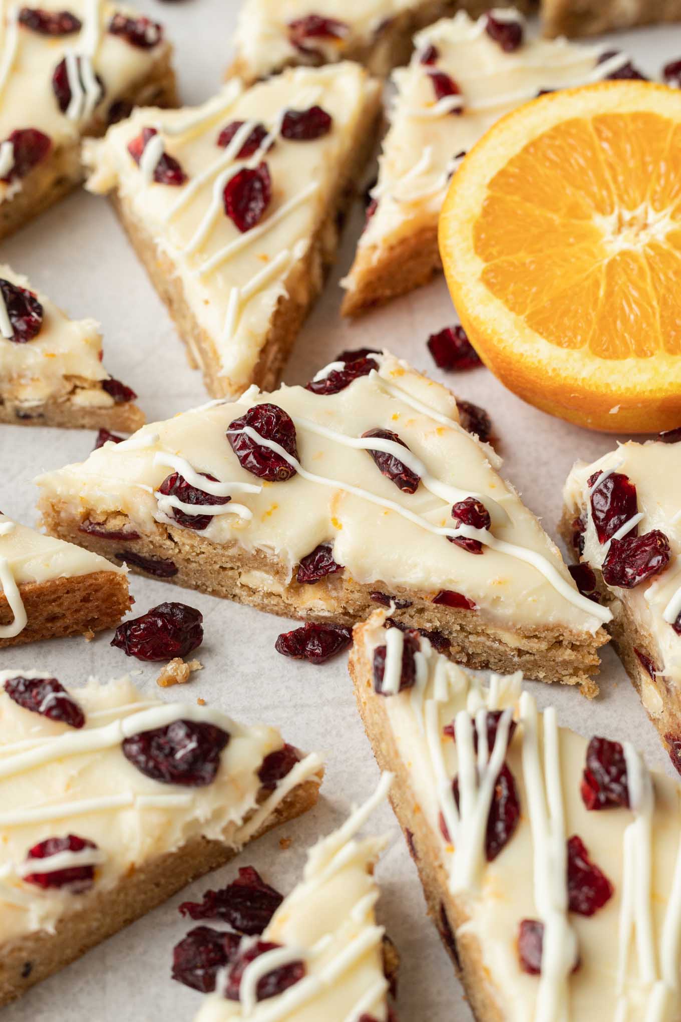 Sliced copycat Starbucks cranberry bliss bars on parchment paper. 