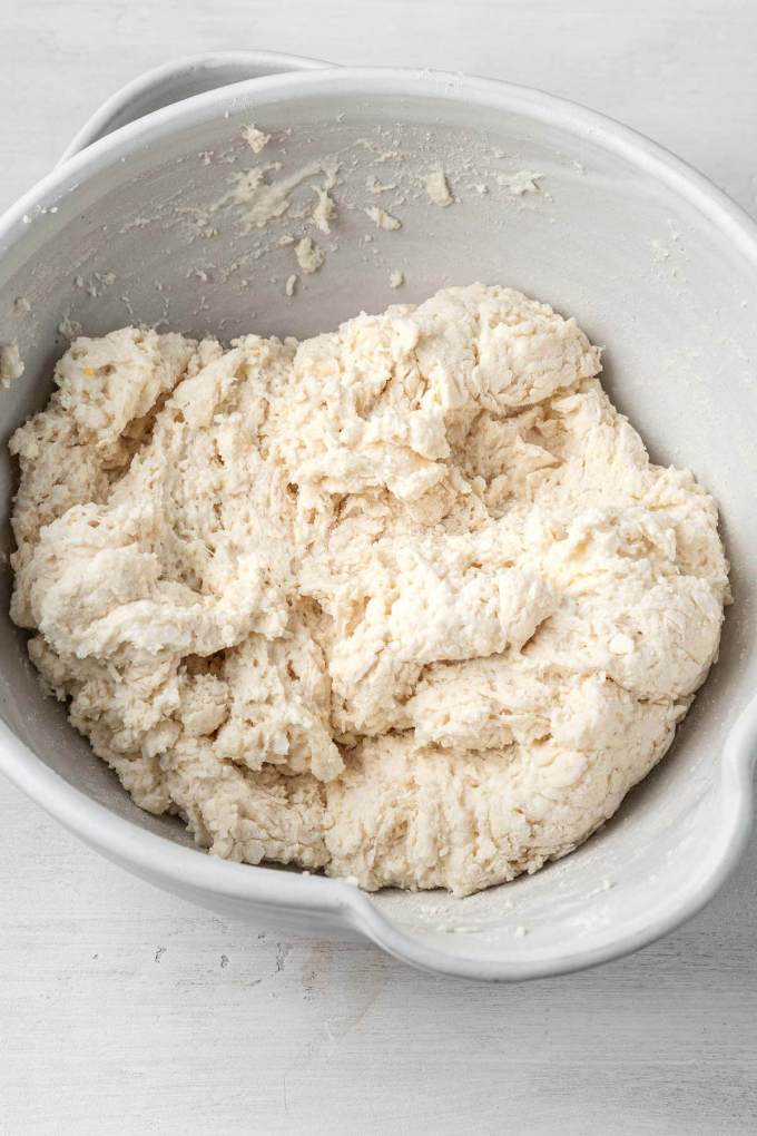 An overhead view of drop biscuit dough in a mixing bowl.