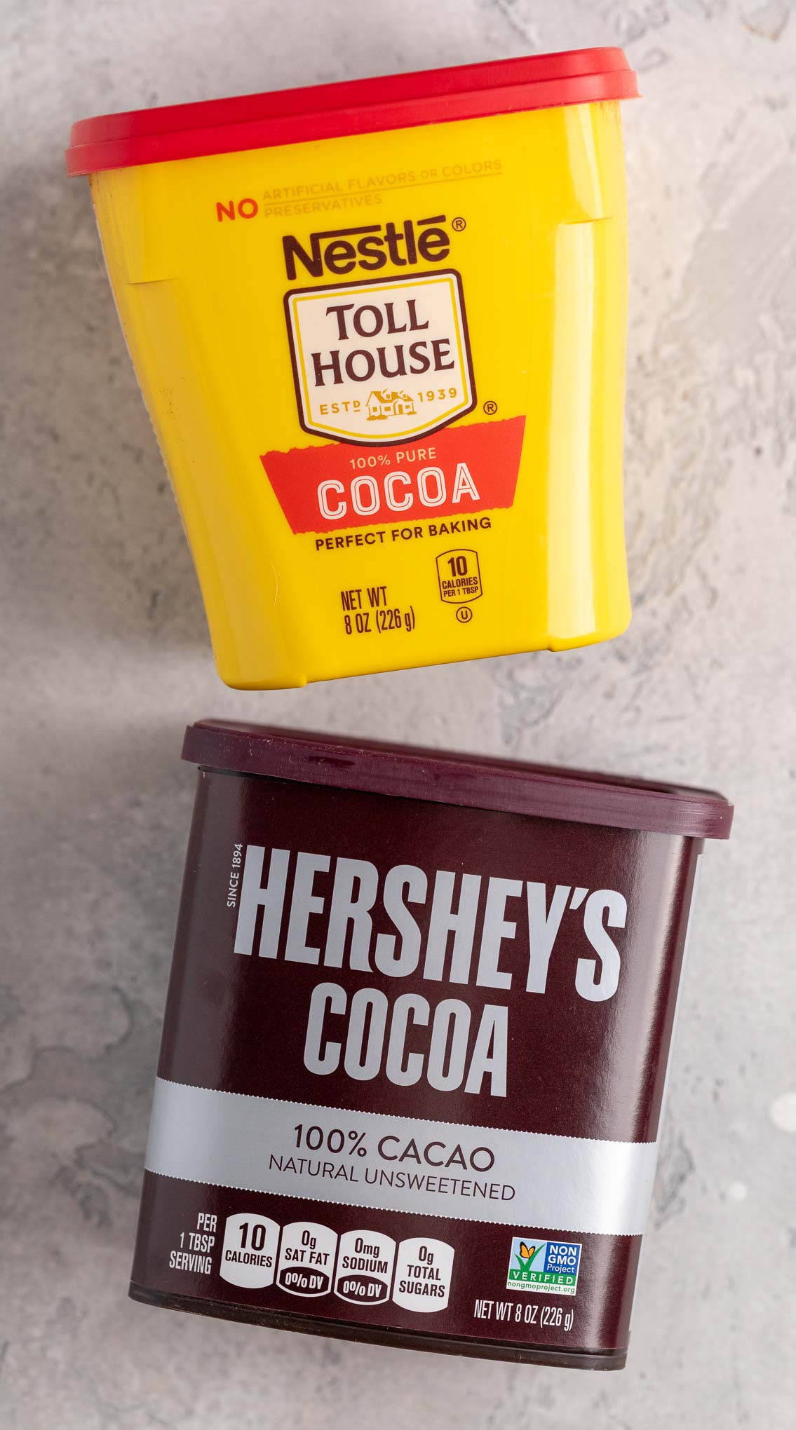 An overhead view of Nestle cocoa powder and Hershey's cocoa powder.