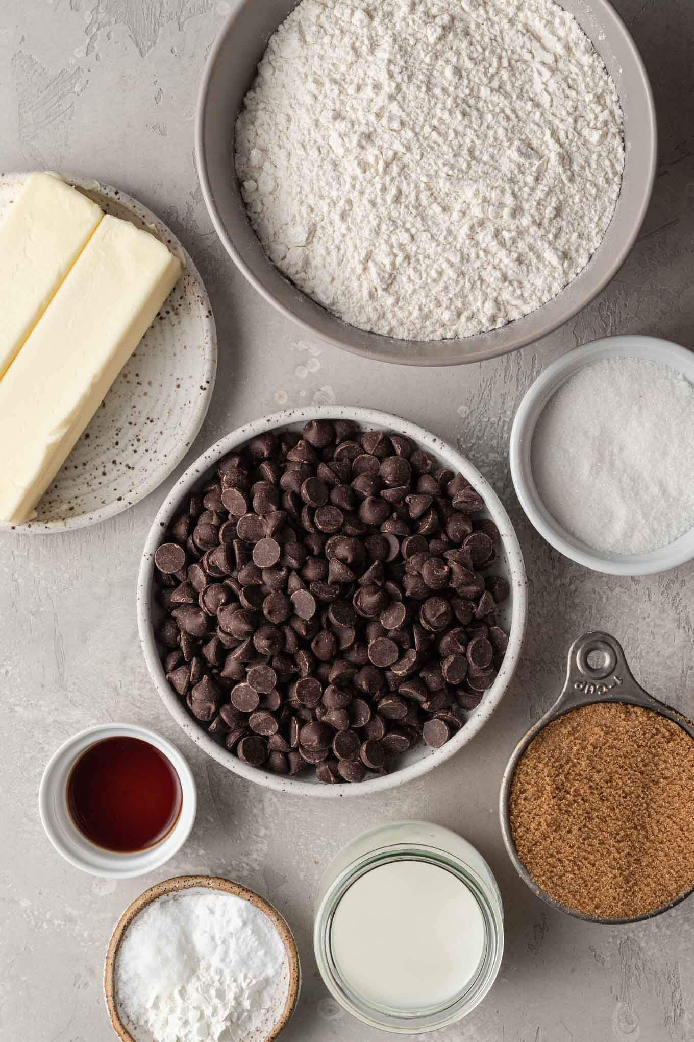 An overhead view of the ingredients to make chocolate chip cookies without eggs. 