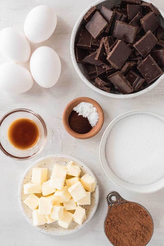 An overhead view of the ingredients needed to make a flourless cake. 