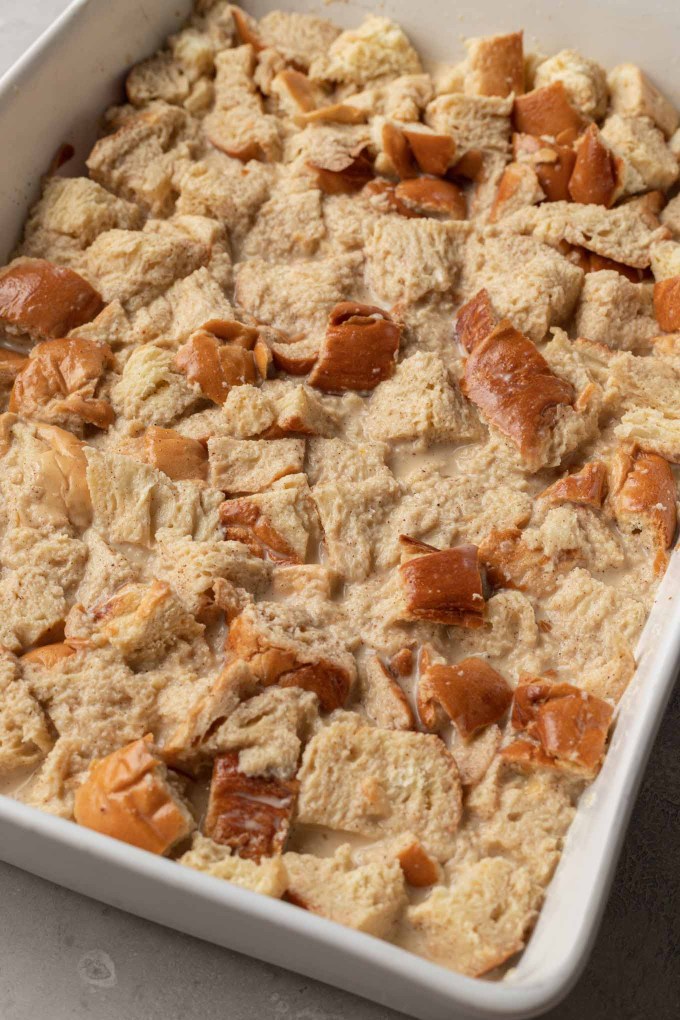 Unbaked challah french toast casserole in a white baking dish.