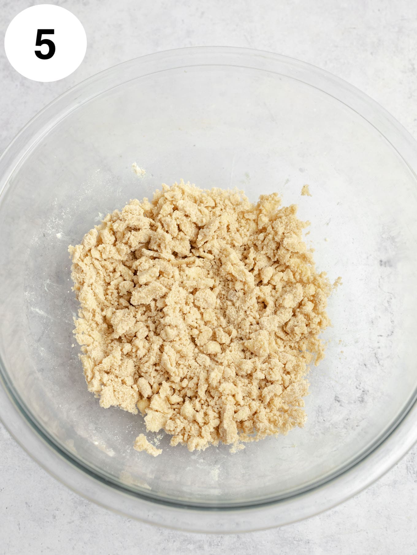 Streusel topping in a glass mixing bowl.