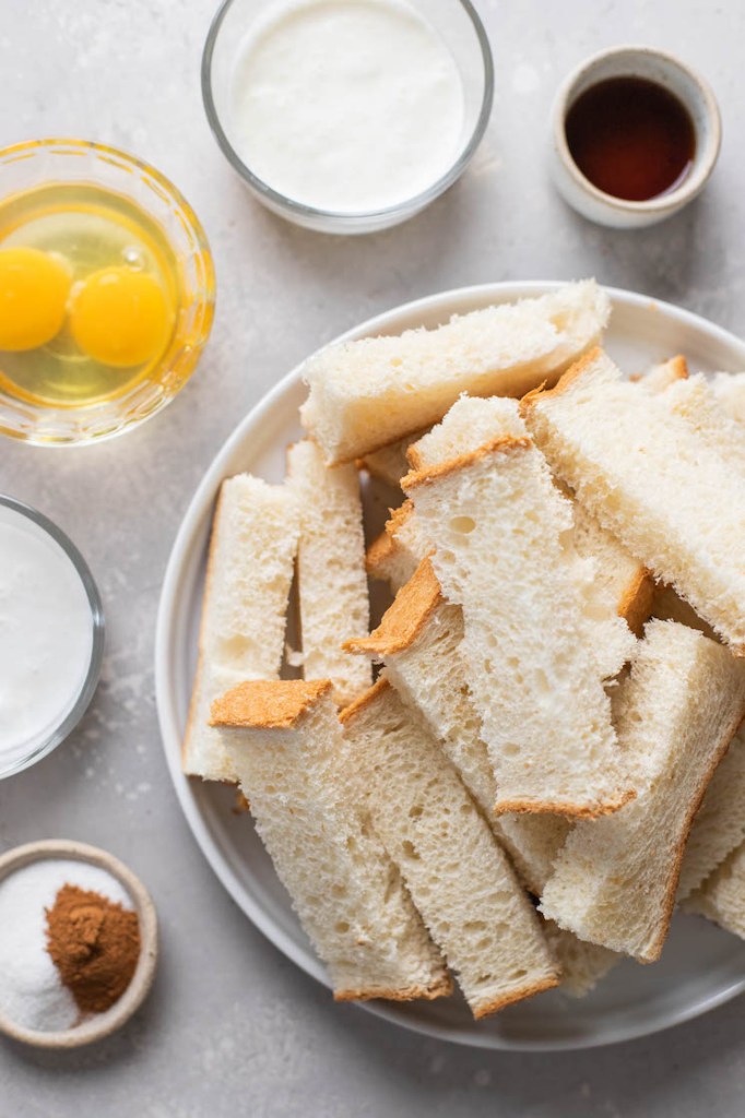 Overhead view of the ingredients needed to make cinnamon french toast sticks. 