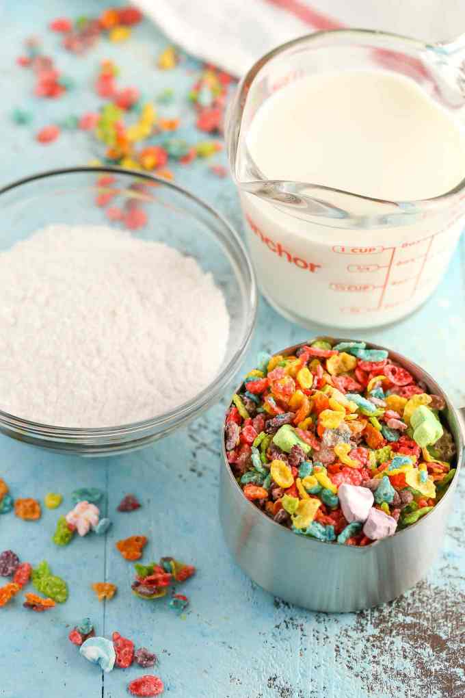 Three ingredient pudding pops filled with Marshmallow Fruity Pebbles! These Marshmallow Fruity Pebbles Pudding Pops make an easy and delicious treat!