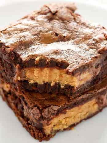 These Fudgy Peanut Butter Cup Brownies start with an easy homemade brownie recipe and are stuffed with peanut butter cups.  These fudgy brownies are the ultimate dessert!