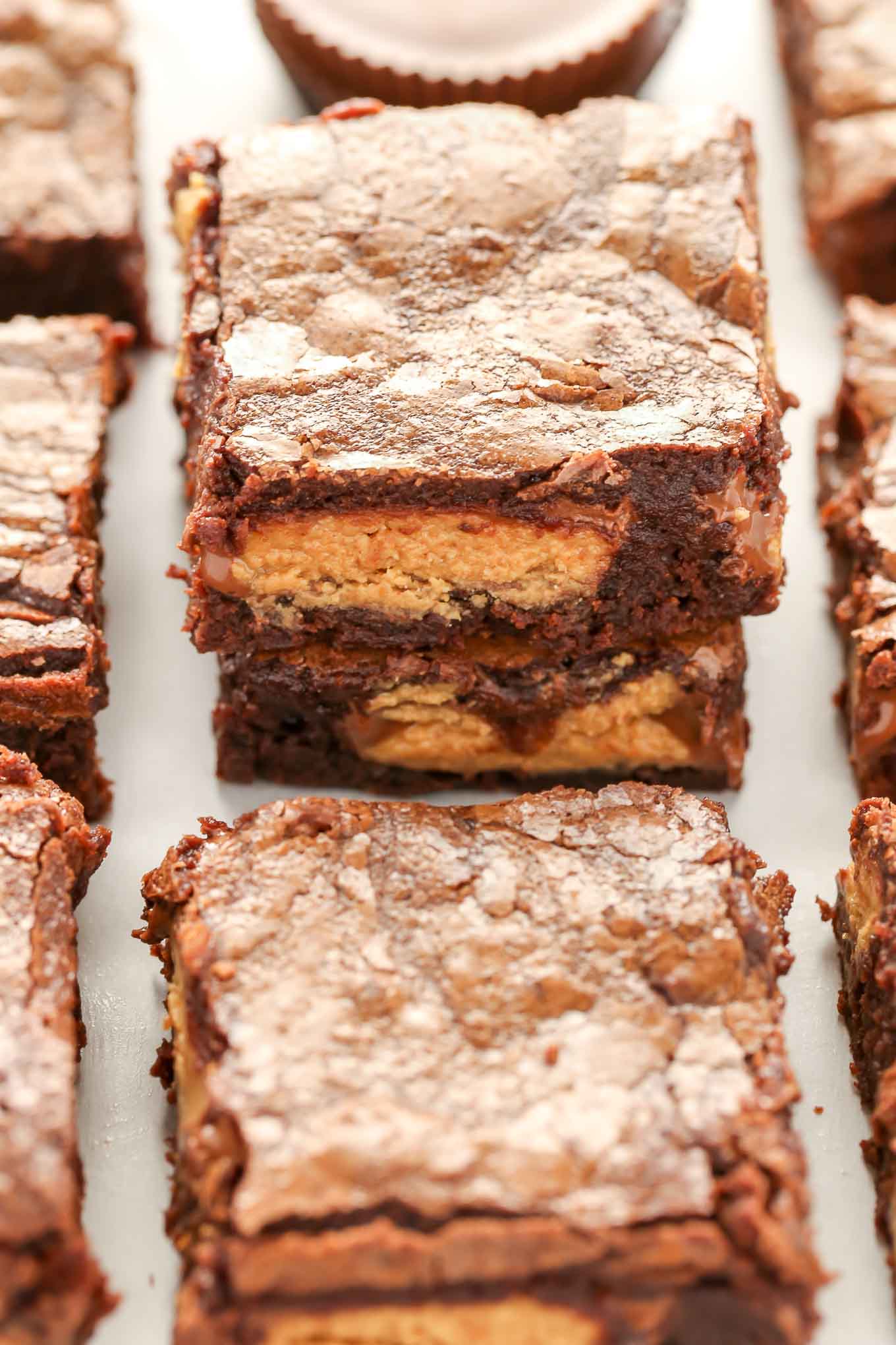 These Fudgy Peanut Butter Cup Brownies start with an easy homemade brownie recipe and are stuffed with peanut butter cups.  These fudgy brownies are the ultimate dessert!