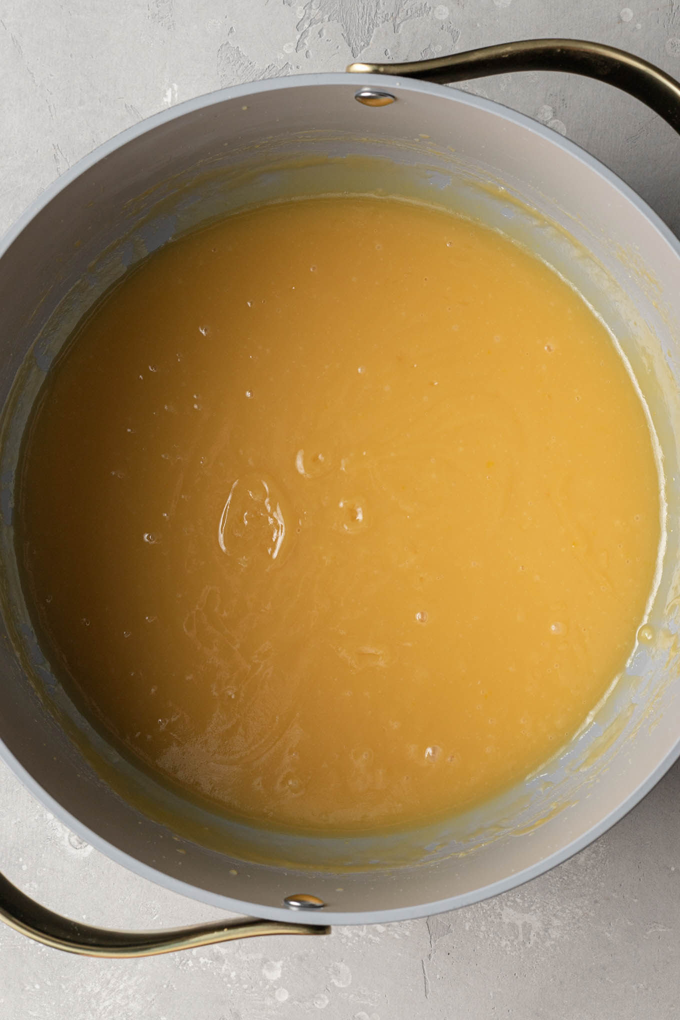 An overhead view of of the base mixture for German chocolate cake frosting in a saucepan. 