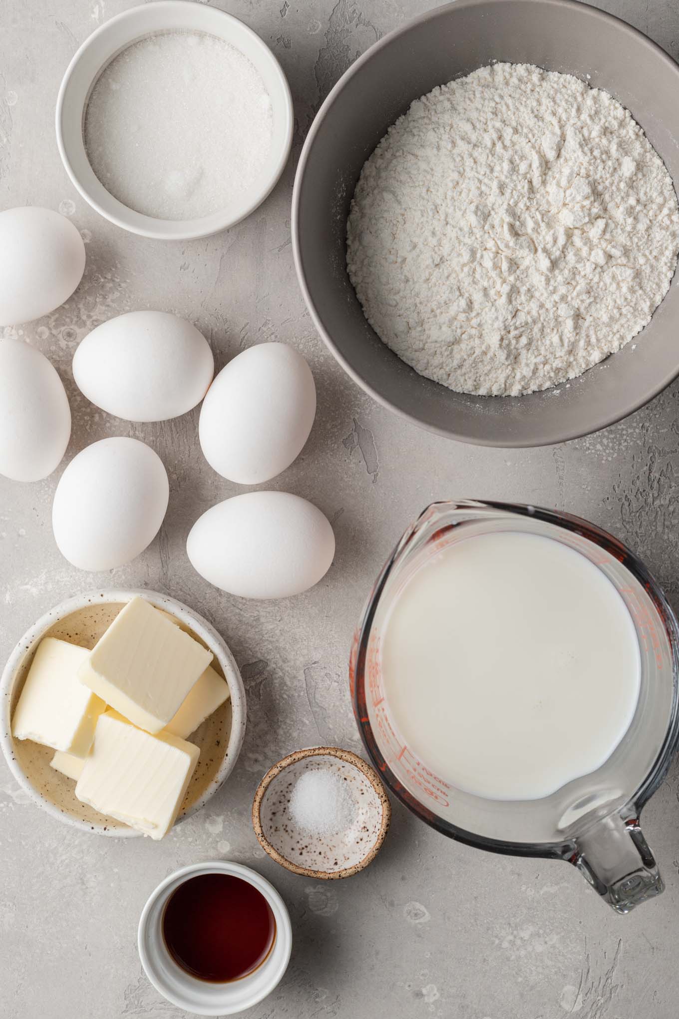 An overhead view of the ingredients needed to make German pancakes. 