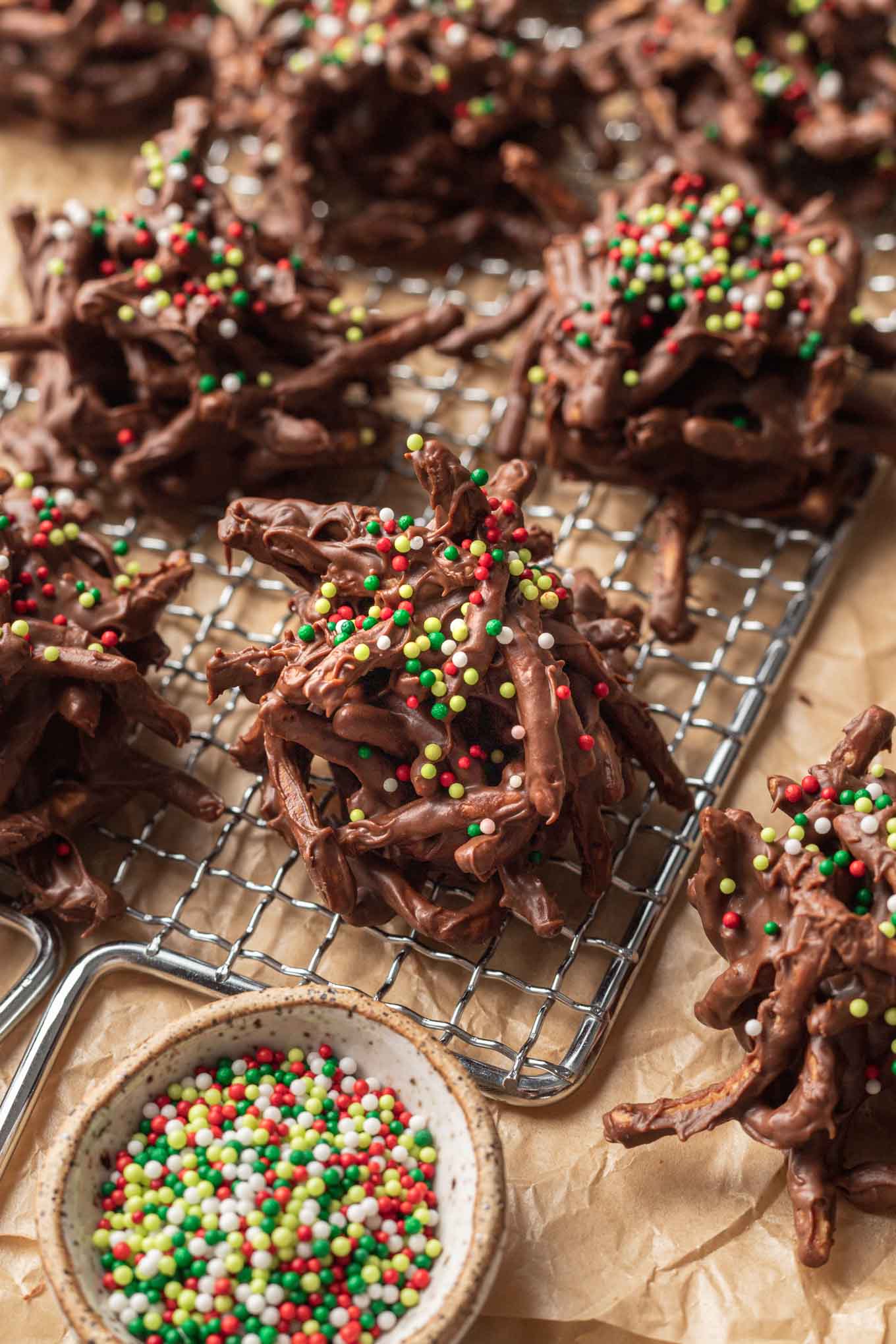 Chocolate haystack cookies on a wire rack, set over parchment paper. 