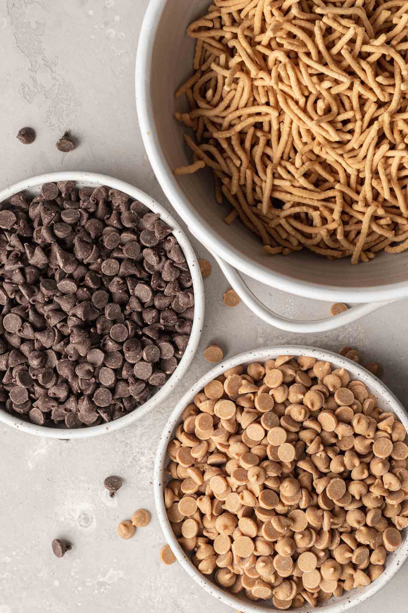 An overhead view of the ingredients needed to make haystack cookies with chow mein noodles. 