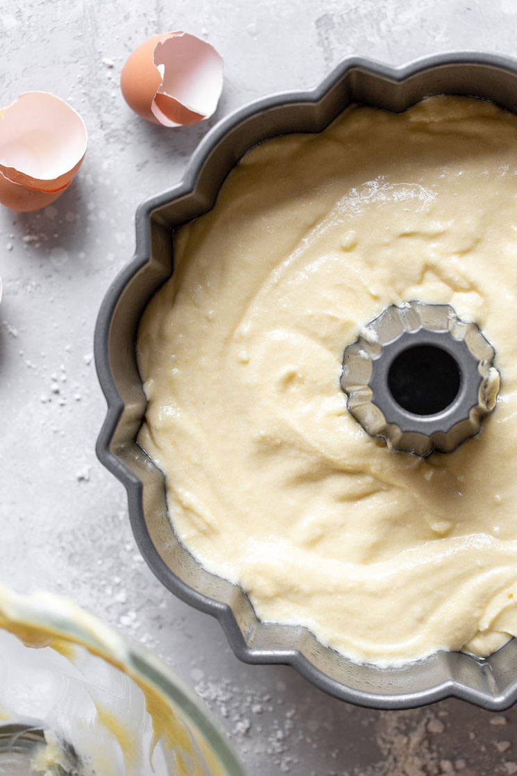 A bundt pan filled with cake batter ready to go into the oven.