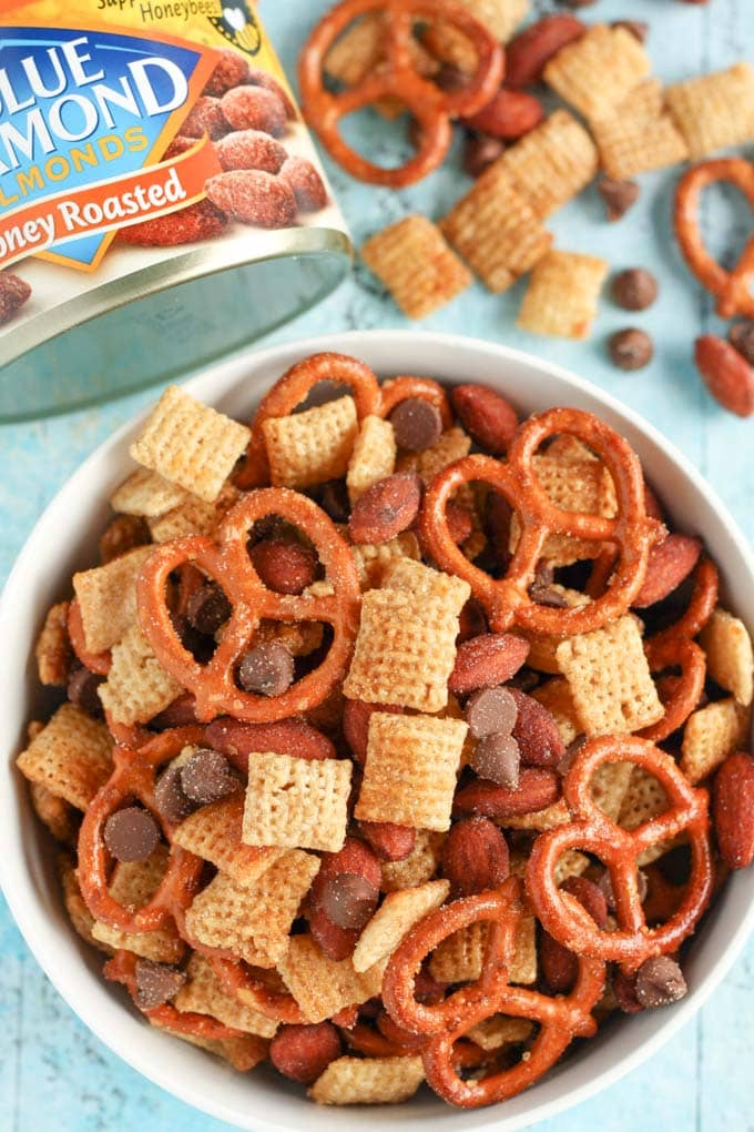 An easy to make snack mix filled with honey, pretzels, chocolate, almonds, and more! This Honey Almond Snack Mix makes a perfect snack for any party or occasion!