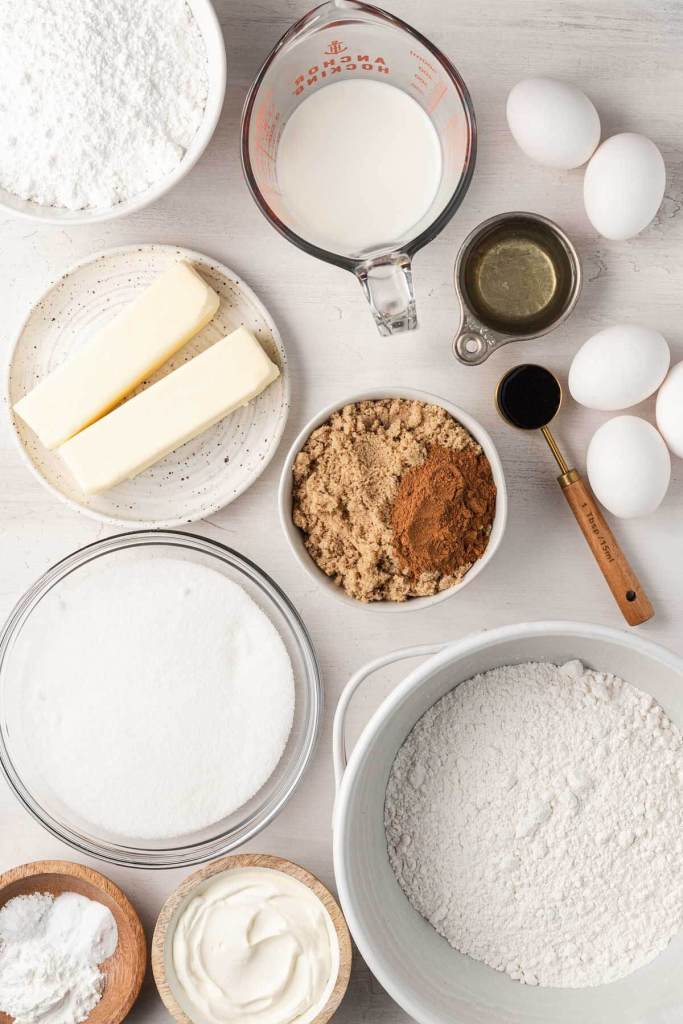 An overhead view of the ingredients for a honey bun cake recipe from scratch. 