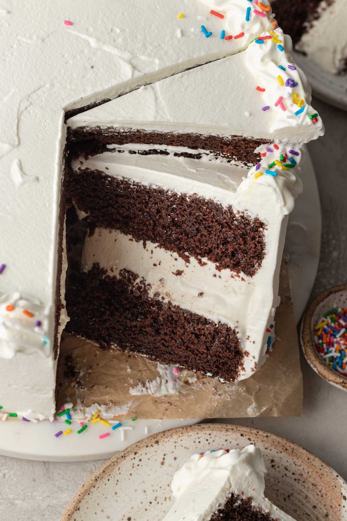 An overhead view of an ice cream cake that's been sliced.