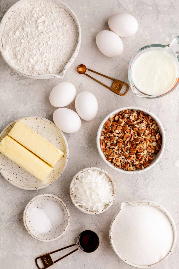 The ingredients needed to make an Italian Cream Cake on a gray surface.