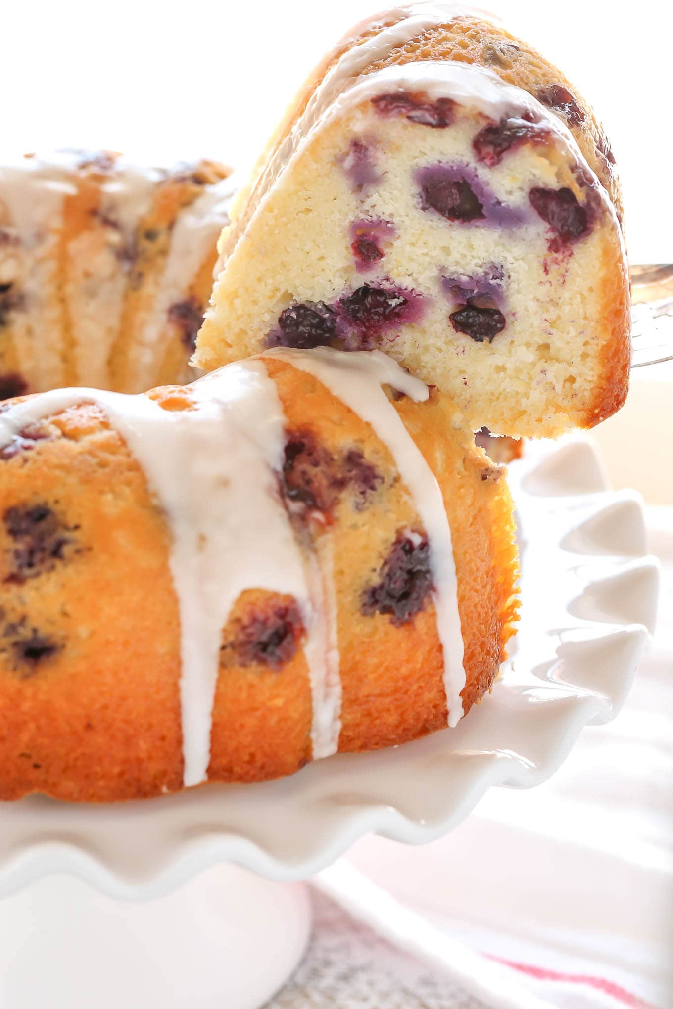 A moist lemon bundt cake filled with fresh blueberries and topped with a sweet lemon glaze. This Lemon Blueberry Bundt Cake is a perfect dessert for lemon lovers!