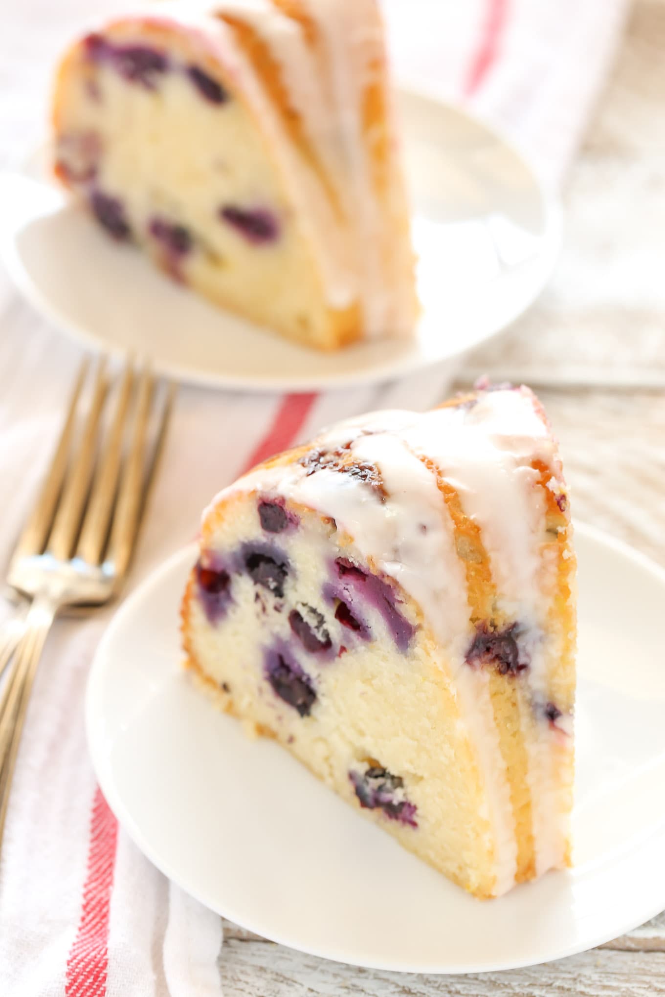 A moist lemon bundt cake filled with fresh blueberries and topped with a sweet lemon glaze. This Lemon Blueberry Bundt Cake is a perfect dessert for lemon lovers!