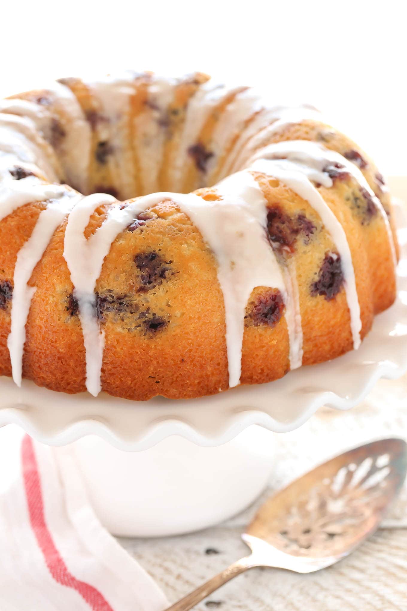 A moist lemon bundt cake filled with fresh blueberries and topped with a sweet lemon glaze. This Lemon Blueberry Bundt Cake is a perfect dessert for lemon lovers!