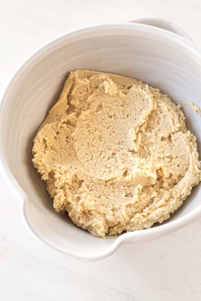 Linzer cookie dough in a large white mixing bowl. 