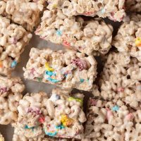 An overhead view of several Lucky Charms treats laying on their side.