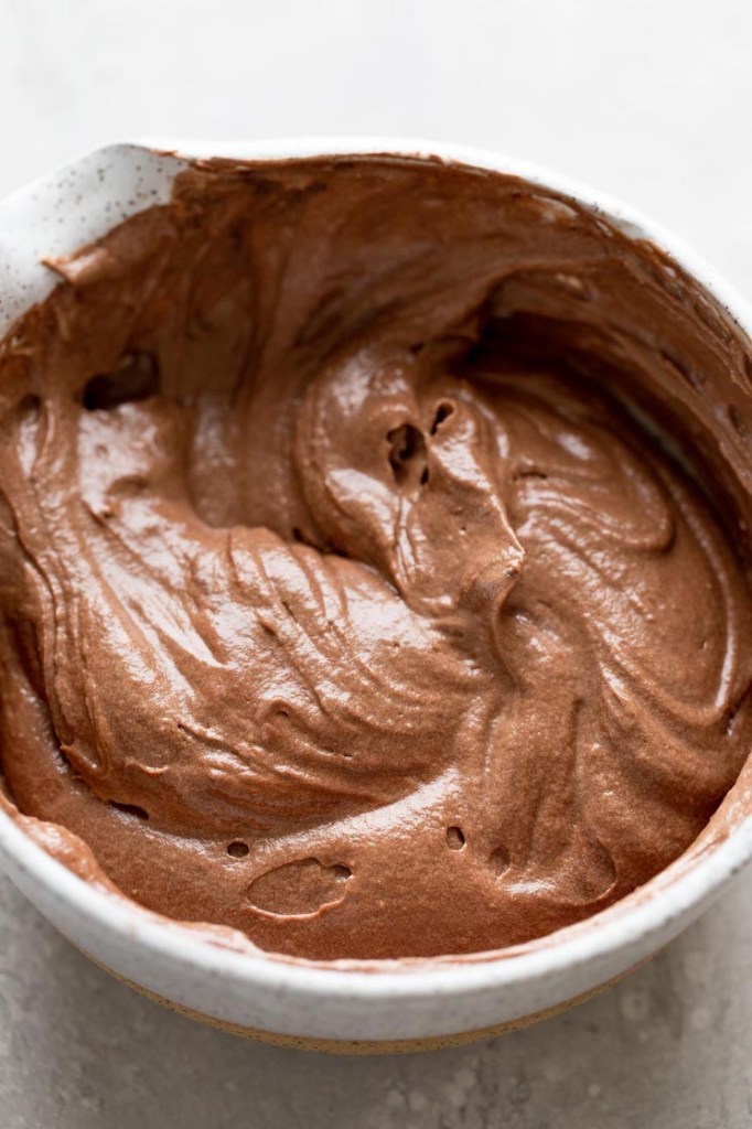 Chocolate cake batter in a mixing bowl. 