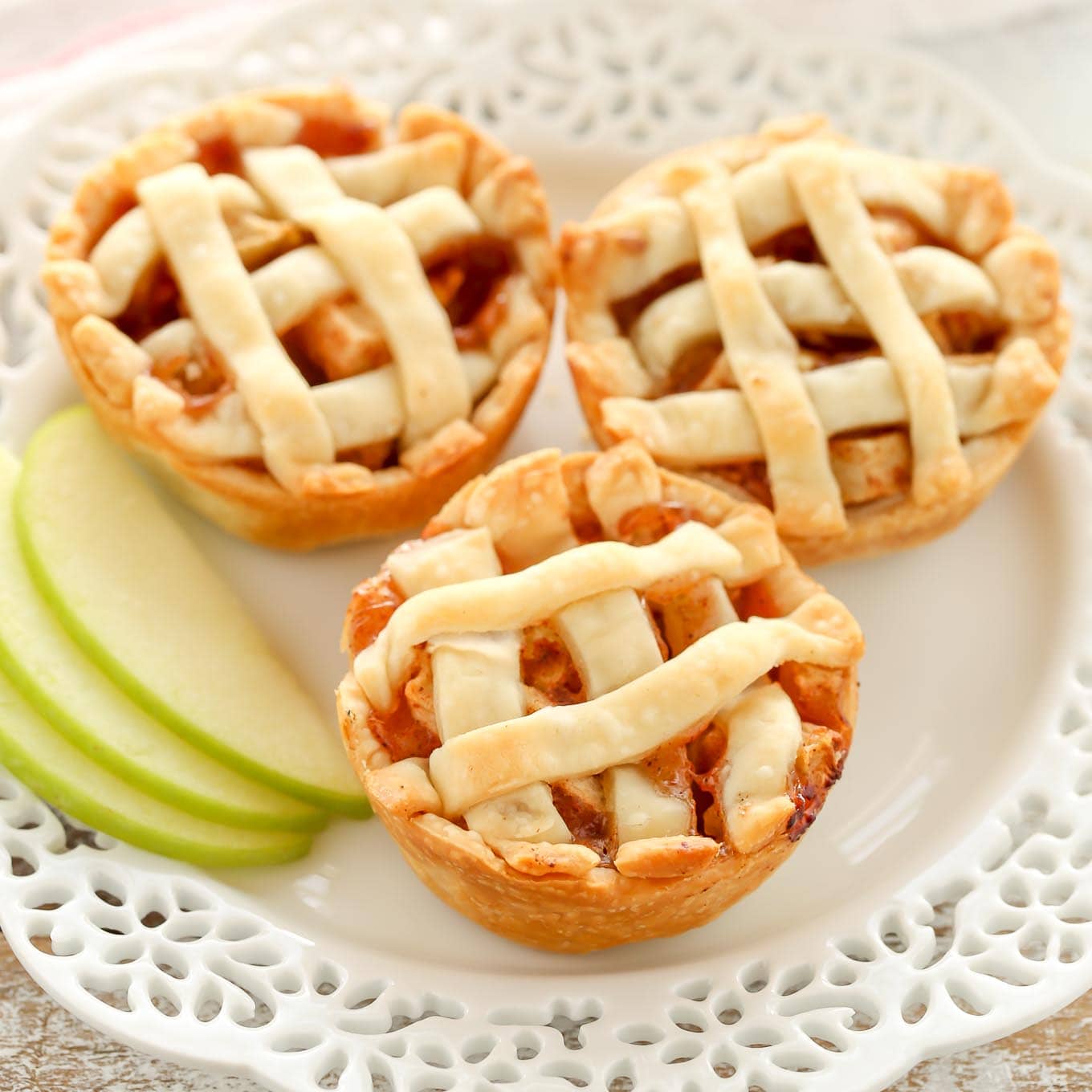 These Mini Apple Pies are easy to make and filled with a simple homemade apple pie filling. The perfect mini dessert for fall!