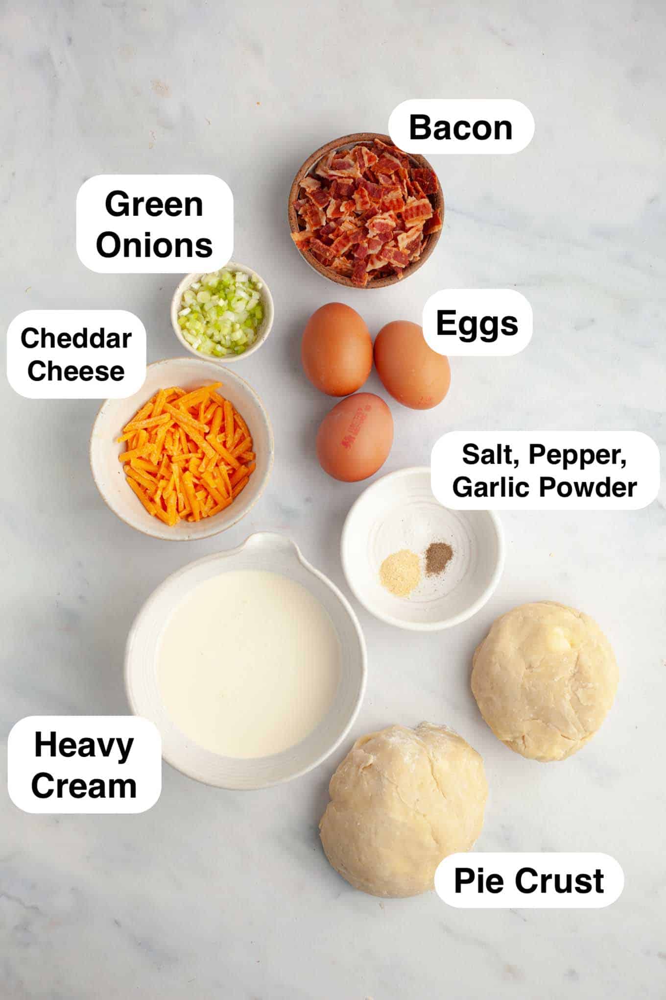 An overhead view of the ingredients needed to make mini breakfast quiche. 