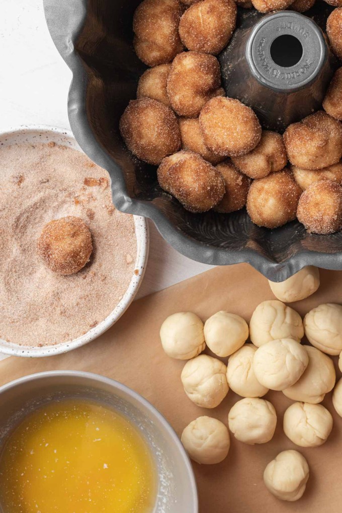 An assembly shot showing how monkey bread is made.