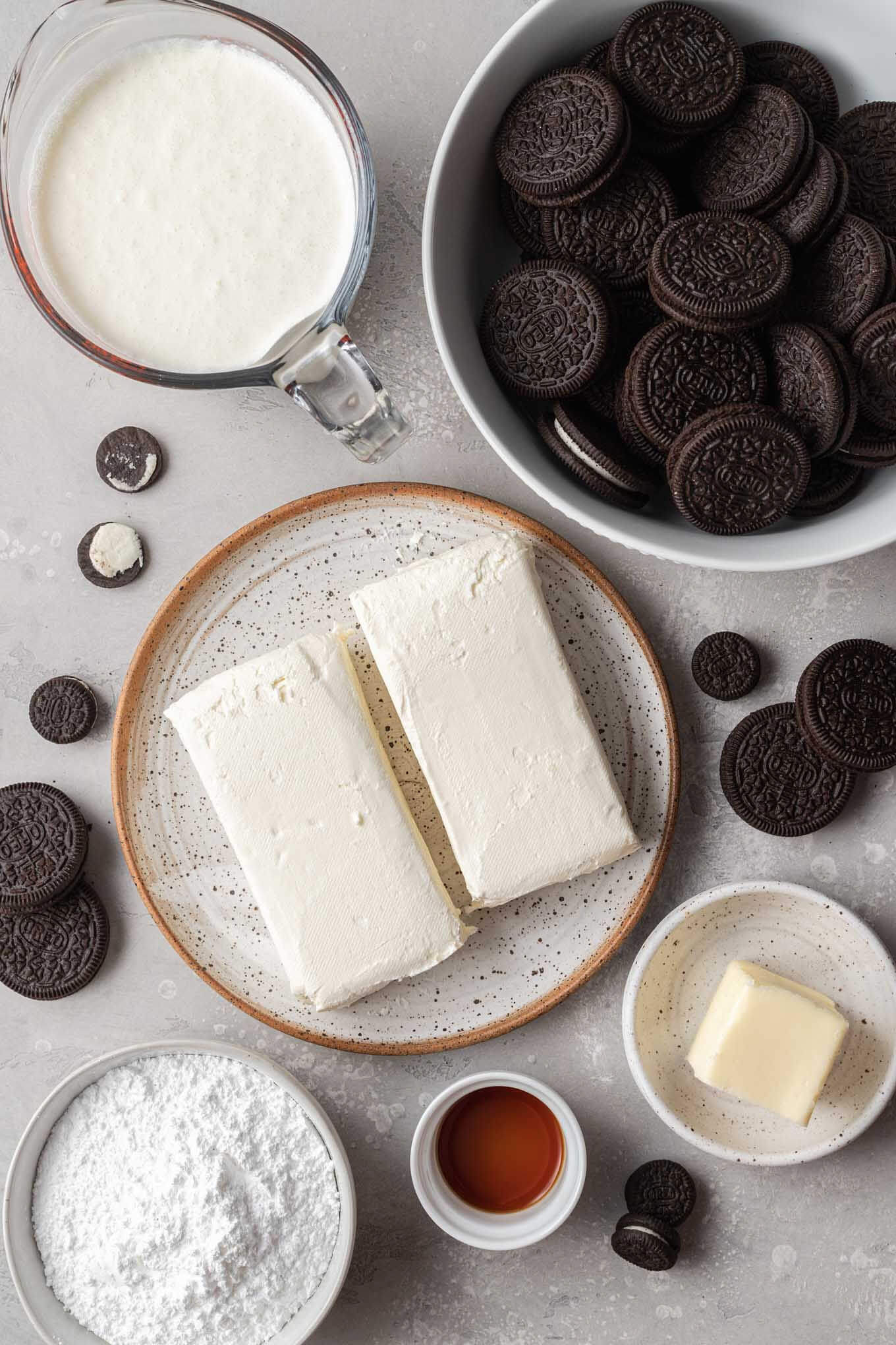 An overhead view of the ingredients needed to make a no bake Oreo cookie cheesecake. 