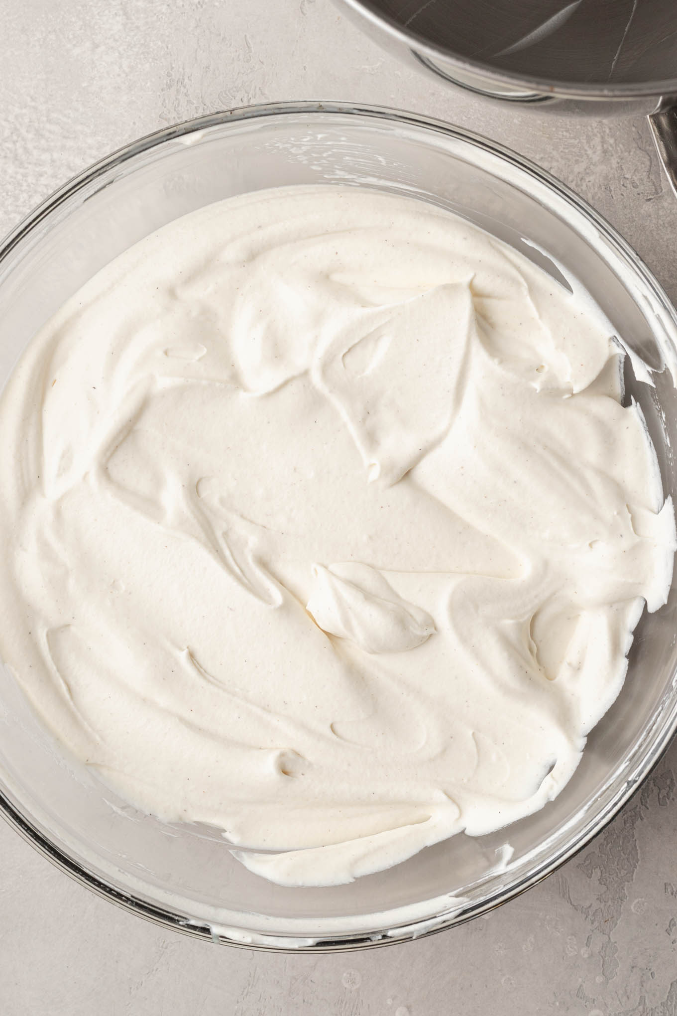 Whipped cream folded into the sweetened condensed milk mixture.