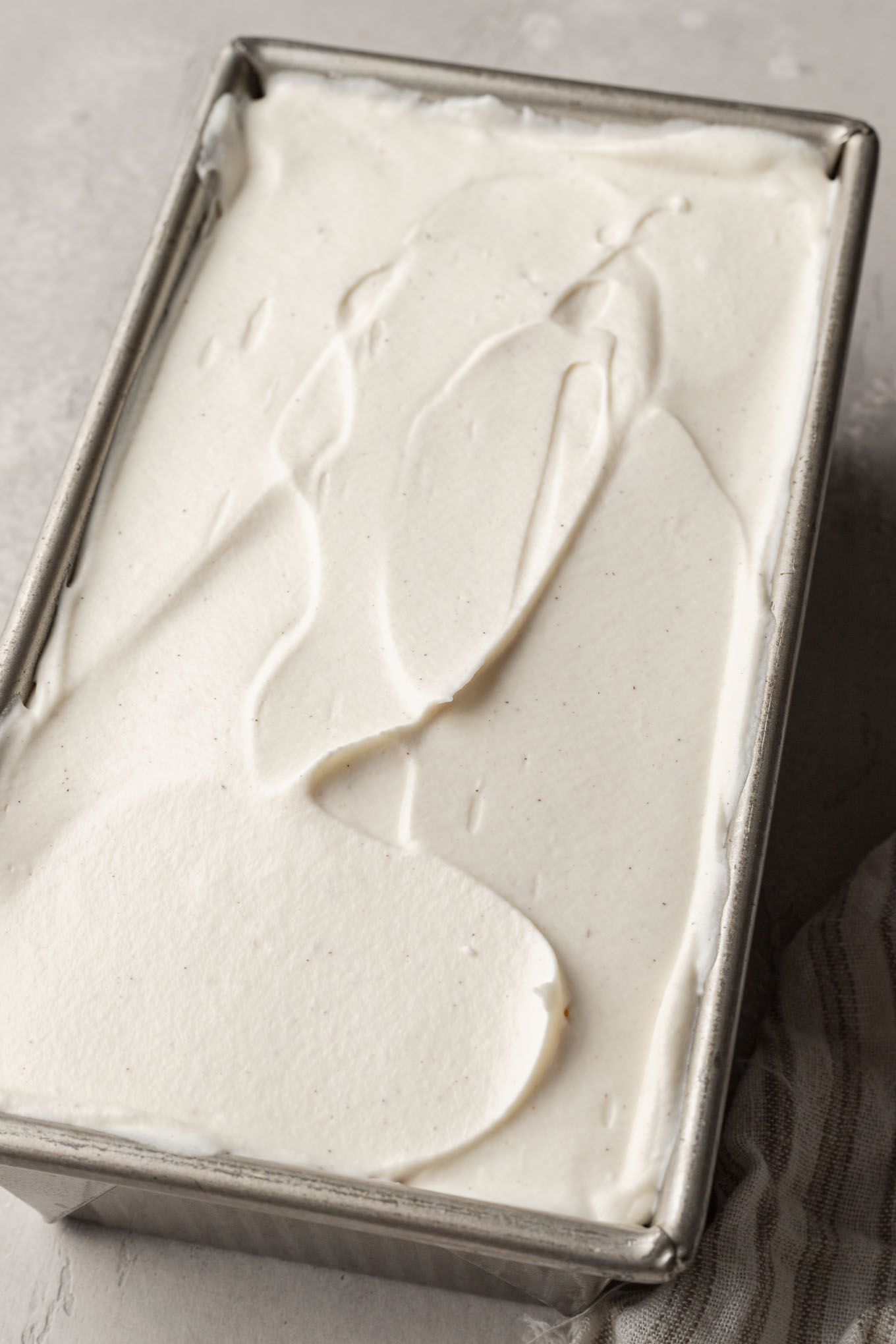 Ice cream spread out into a 9x5 loaf pan.