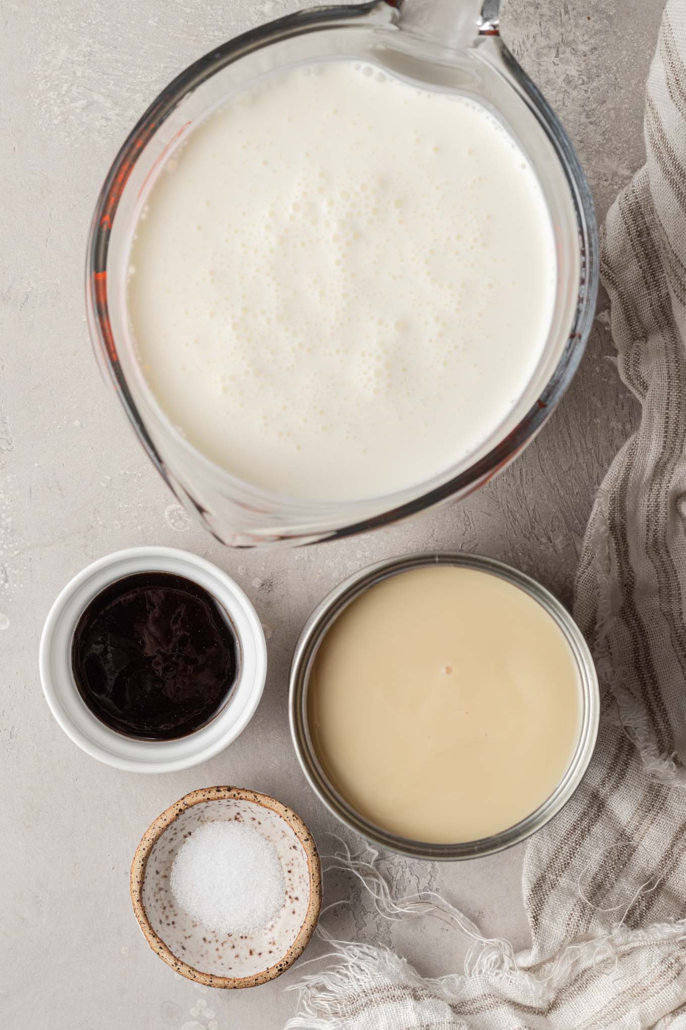 An overhead view of the ingredients needed to make ice cream with sweetened condensed milk. 